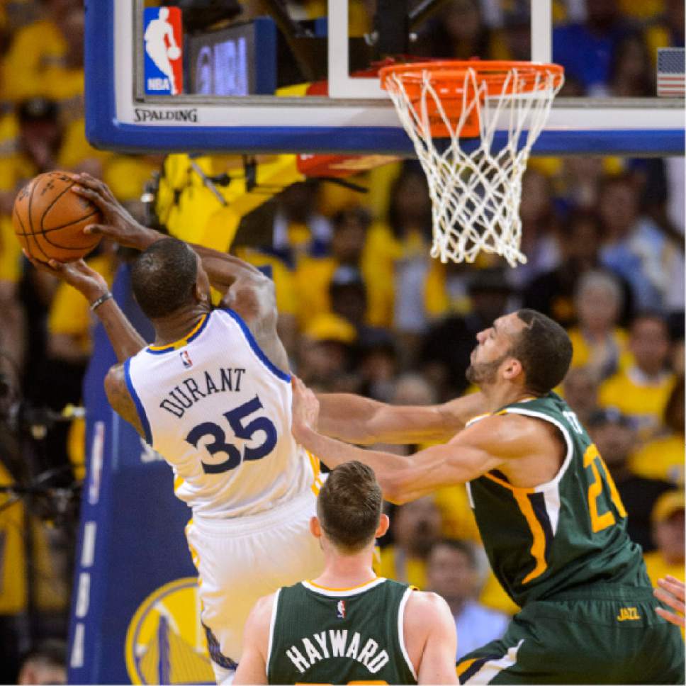 Steve Griffin  |  The Salt Lake Tribune


Utah Jazz center Rudy Gobert (27) pushes Golden State Warriors forward Kevin Durant (35) away from the basket and is called for a foil during NBA playoff game between the Utah Jazz and the Golden State Warriors at Oracle Arena in Oakland Tuesday May 2, 2017.