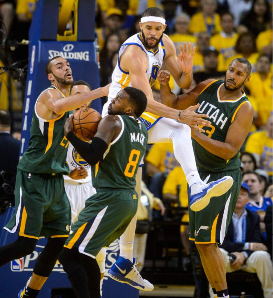 Steve Griffin  |  The Salt Lake Tribune


Utah Jazz guard Shelvin Mack (8) rips a rebound away from Golden State Warriors center JaVale McGee (1) during NBA playoff game between the Utah Jazz and the Golden State Warriors at Oracle Arena in Oakland Tuesday May 2, 2017.