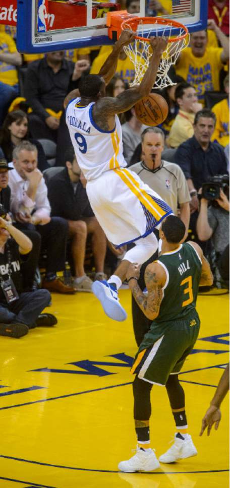 Steve Griffin  |  The Salt Lake Tribune


Golden State Warriors forward Andre Iguodala (9) slams down the ball over Utah Jazz guard George Hill (3) during NBA playoff game between the Utah Jazz and the Golden State Warriors at Oracle Arena in Oakland Tuesday May 2, 2017.