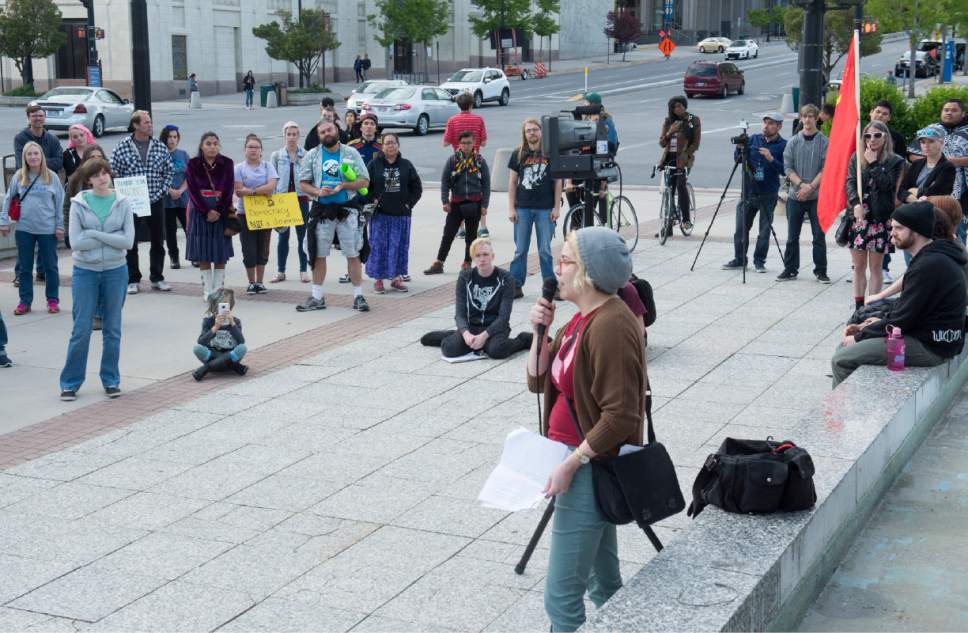 Rick Egan  |  The Salt Lake Tribune

Summer Smith speaks to more than100 protestors meet to listen to speakers during a May Day rally to celebrate the history of struggle that all working and oppressed people share, and resolve to fight together and win, at the Federal Building in Salt Lake City, Monday, May 1, 2017.