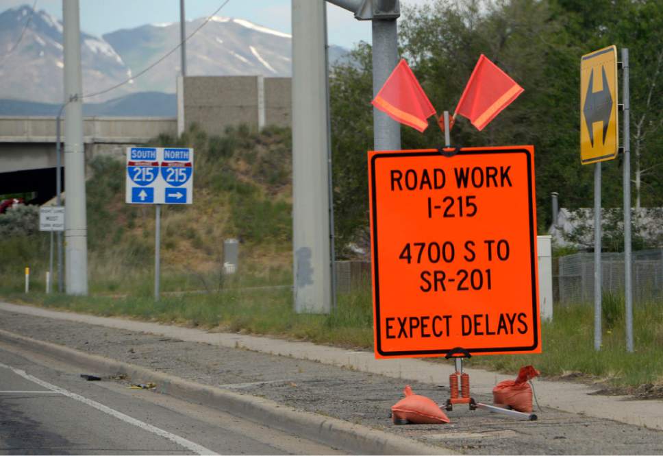 Al Hartmann  |  Tribune file photo
Sign warns motorists of construction ahead at 3500 South onramp onto I-215. Crews are reconstructing the freeway with new concrete, adding auxiliary lanes, and replacing the bridges over S.R. 201 from State Road 201 to 4700 South. All lanes remain open, but traffic is shifted and lanes have been narrowed. Over the Memorial Day holiday weekend travelers will have busy roads and construction projects that could slow traffic and contribute to the likelihood of accidents.