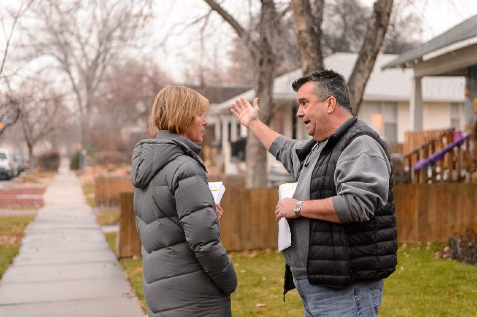 Trent Nelson  |  The Salt Lake Tribune
Salt Lake City resident Mike Lobb expresses his displeasure over the announced homeless shelter at 653 E. Simpson Avenue to Councilwoman Lisa Adams, Wednesday December 14, 2016. Adams went door-to-door in the area to hear from and explain to residents what they should expect from the planned homeless shelter at that address. Adams was accompanied by a police officer after receiving threatening emails.