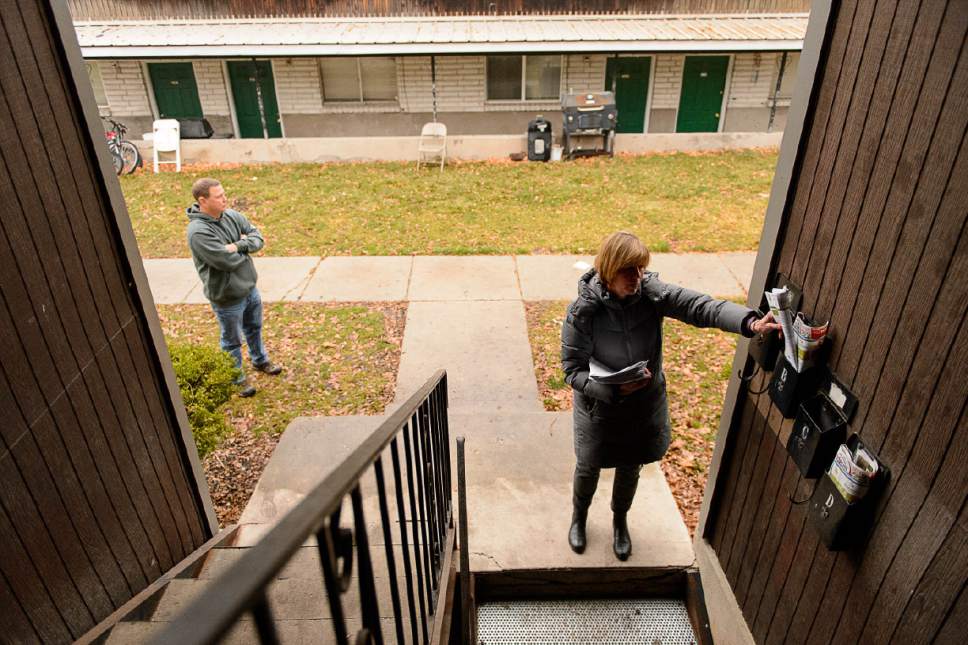 Trent Nelson  |  The Salt Lake Tribune
Salt Lake City Councilwoman Lisa Adams goes door-to-door in the area around 653 E. Simpson Avenue to explain to residents what they should expect from the planned homeless shelter at that address, Wednesday December 14, 2016. She was accompanied by Detective Keith Peterson after receiving threatening emails.