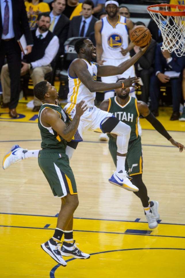 Steve Griffin  |  The Salt Lake Tribune


Golden State Warriors forward Draymond Green (23) splits the Jazz defense as he scores a bucket during NBA playoff game between the Utah Jazz and the Golden State Warriors at Oracle Arena in Oakland Tuesday May 2, 2017.