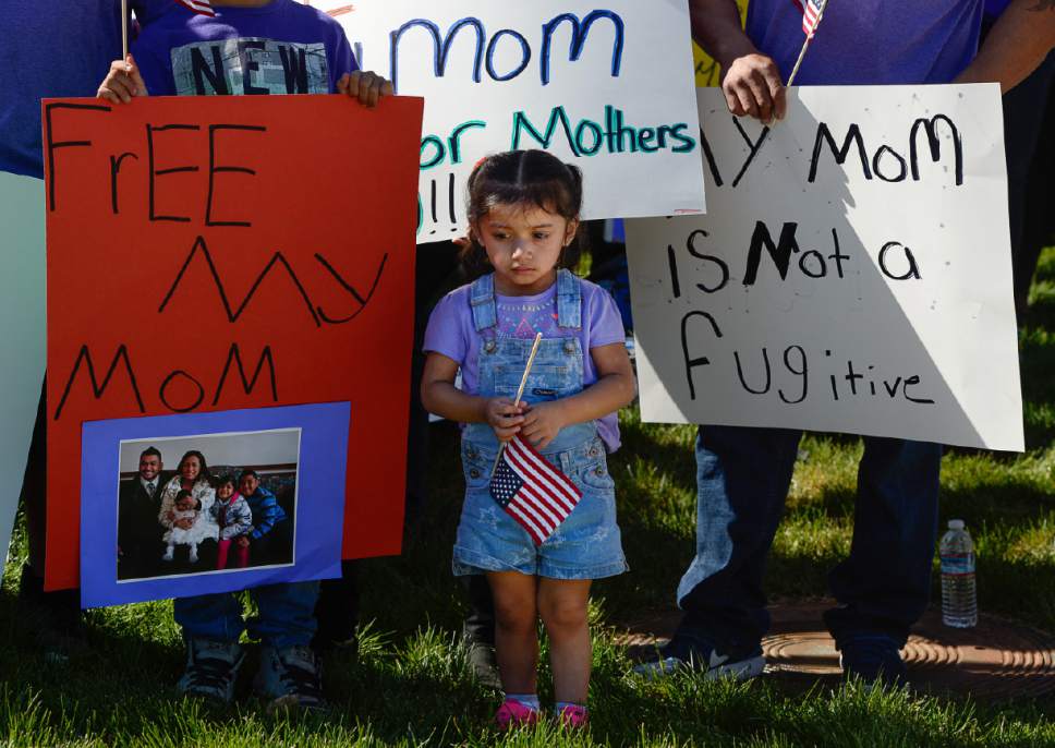 Francisco Kjolseth | The Salt Lake Tribune
Ariana Juarez, 2, who's mother was detained by ICE agents and taken to an undisclosed location last week, stands in silence during a rally by Mormon Women for Ethical Government and other concerned citizens who gathered at the Department of Homeland Security field office in West Valley City on Wed. May 3, 2017, in a show of solidarity for the young mother, Silvia Avelar-Flores, who was arrested.
