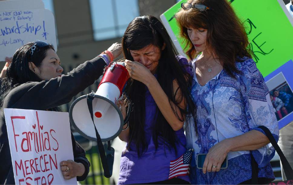 Francisco Kjolseth | The Salt Lake Tribune
Abigail Tapia, 15, is comforted as she speaks about missing her aunt, Silvia Avelar-Flores, who was detained by ICE agents in a Michaels parking lot last week in front of her 8-year-old daughter. Mormon Women for Ethical Government and other concerned citizens gathered at the Department of Homeland Security field office in West Valley City on Wed. May 3, 2017, in a show of solidarity for a young mother and her family.