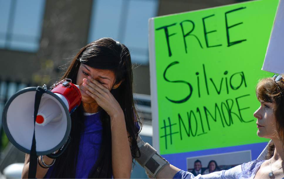 Francisco Kjolseth | The Salt Lake Tribune
Abigail Tapia, 15, becomes emotional as she speaks about missing her aunt, Silvia Avelar-Flores, who was detained by ICE agents in a Michaels parking lot last week in front of her 8-year-old daughter. Mormon Women for Ethical Government and other concerned citizens gathered at the Department of Homeland Security field office in West Valley City on Wed. May 3, 2017, in a show of solidarity for a young mother.