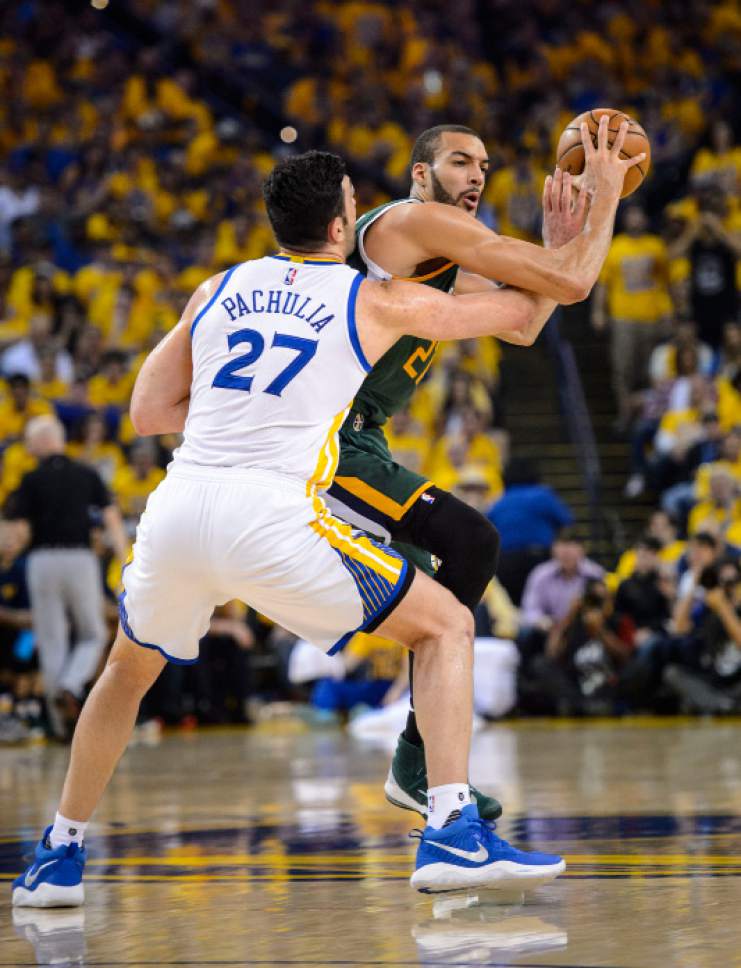Steve Griffin  |  The Salt Lake Tribune
Utah Jazz center Rudy Gobert is guarded by Golden State Warriors center Zaza Pachulia on Tuesday during Game 1 of their second-round series in Oakland, Calif.