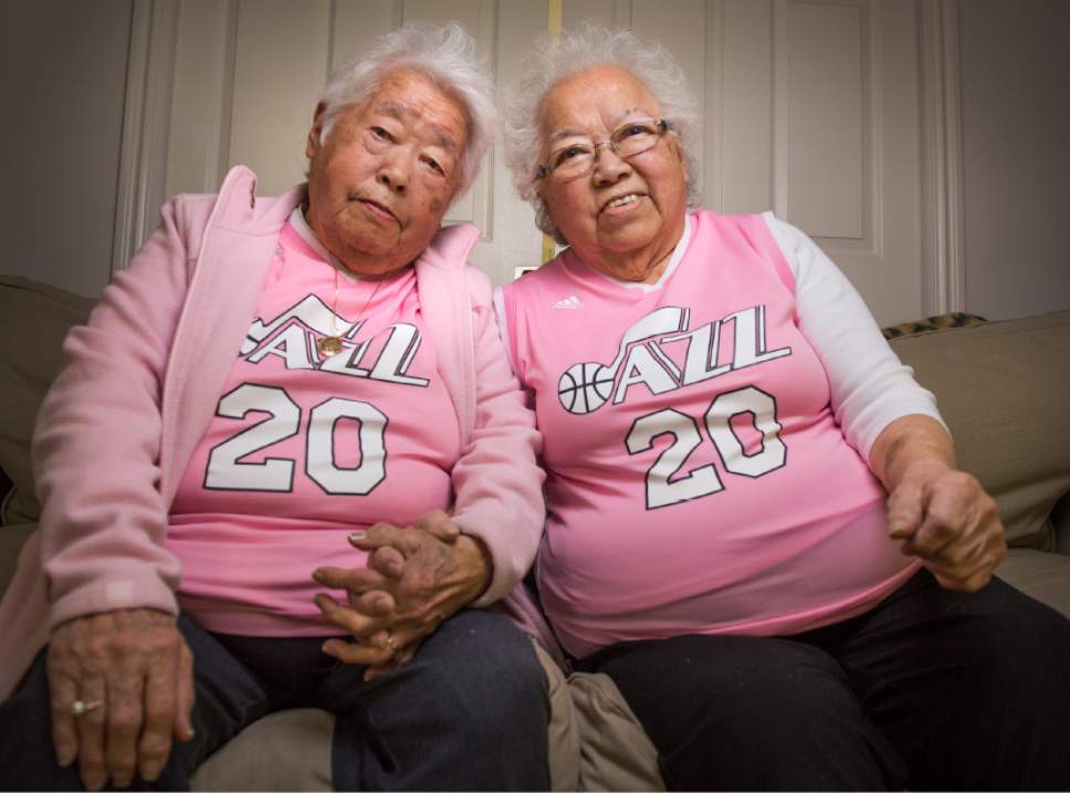 Leah Hogsten  |  The Salt Lake Tribune 
l-r Chances are that if you've been to a Utah Jazz basketball game, you've seen sister Yeiko Homma and Keiko Mori on the jumbo screens. The two women always dressed in pink jerseys at Jazz games are known locally as "The Pink Grandmas." The two are ready to watch game 7 of the playoff series between the Utah Jazz and the Los Angeles Clippers, Sunday, April 30, 2017.
