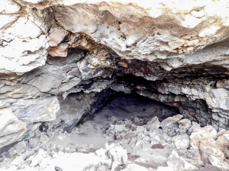 Erin Alberty  |  The Salt Lake Tribune


Daylight spills a lava tube on Tabernacle Hill near Meadow in Millard County -- but farther back, the tunnel becomes pitch black before its other opening comes into view. Photo taken March 7, 2017.