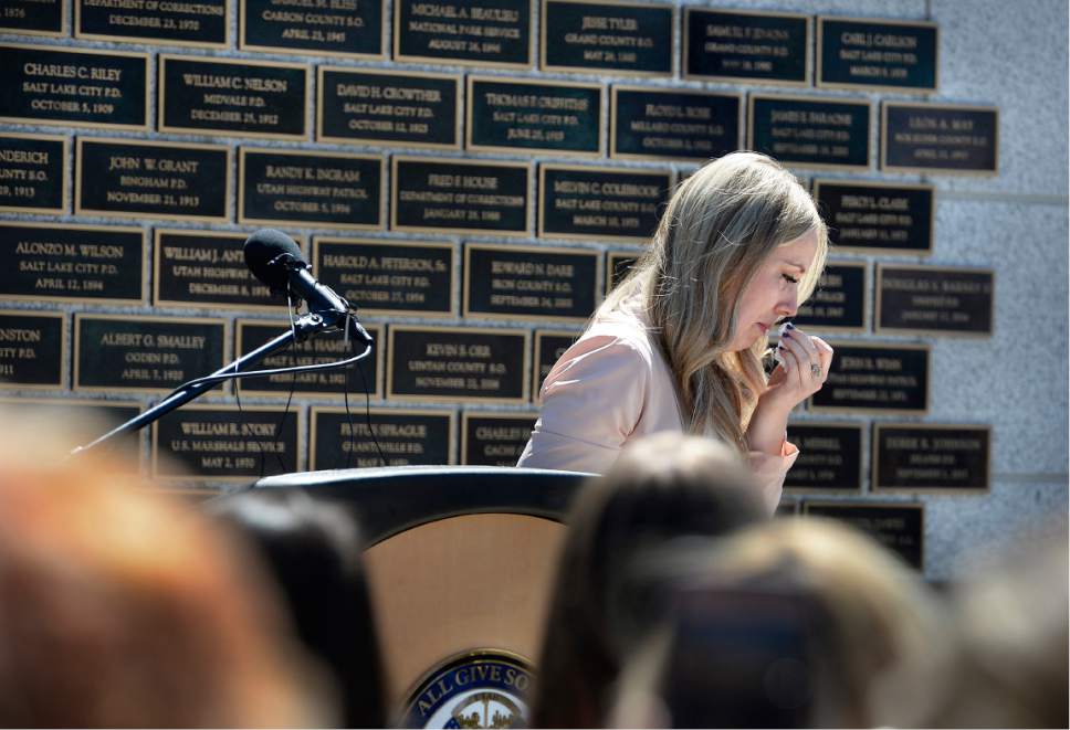 Scott Sommerdorf | The Salt Lake Tribune
Janica Ellsworth, widow of Trooper Eric Ellsworth tearfully returns to her seat after speaking about her husband at the annual Utah Law Enforcement Memorial, Thursday, May 4, 2017.