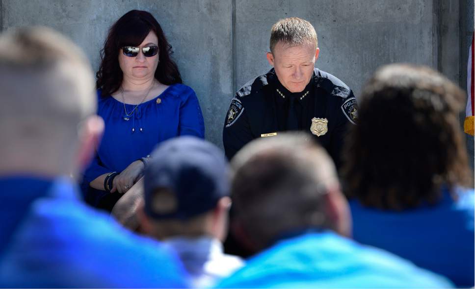 Scott Sommerdorf | The Salt Lake Tribune
Jenny Brotherson, mother of Officer Cody Ellsworth, left, and Kaysville Chief of Police Sol Oberg, hold back emotions as they listen to Janica Ellsworth speak about her husband during the annual Utah Law Enforcement Memorial, Thursday, May 4, 2017.