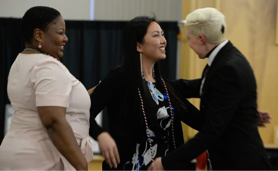 Francisco Kjolseth | The Salt Lake Tribune
Stephanie Yu who will be graduating with four bachelor's degrees: Honors management, marketing, Chinese and international studies is congratulated by Dr. Nicole Robinson, left, and Dr. Kathryn Stockton as the University of Utah's Center for Ethnic Affairs holds its annual graduation celebration for students and their families in a more intimate event prior to commencement ceremonies on Thursday, April 27, 2017 at the A. Ray Olpin Union Building.