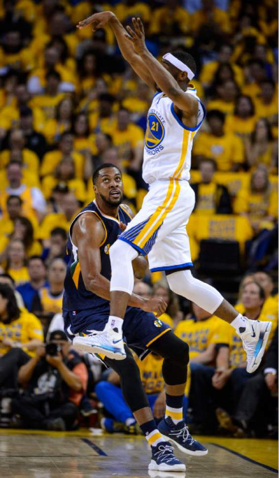 Steve Griffin  |  The Salt Lake Tribune


Golden State Warriors guard Ian Clark (21) leaps in the air as he passes over Utah Jazz forward Derrick Favors (15) during game 2 of the NBA playoff game between the Utah Jazz and the Golden State Warriors at Oracle Arena in Oakland Thursday May 4, 2017.