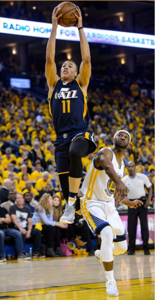 Steve Griffin  |  The Salt Lake Tribune


Utah Jazz guard Dante Exum (11) gets past Golden State Warriors guard Ian Clark (21) as he gets to the basket during game 2 of the NBA playoff game between the Utah Jazz and the Golden State Warriors at Oracle Arena in Oakland Thursday May 4, 2017.