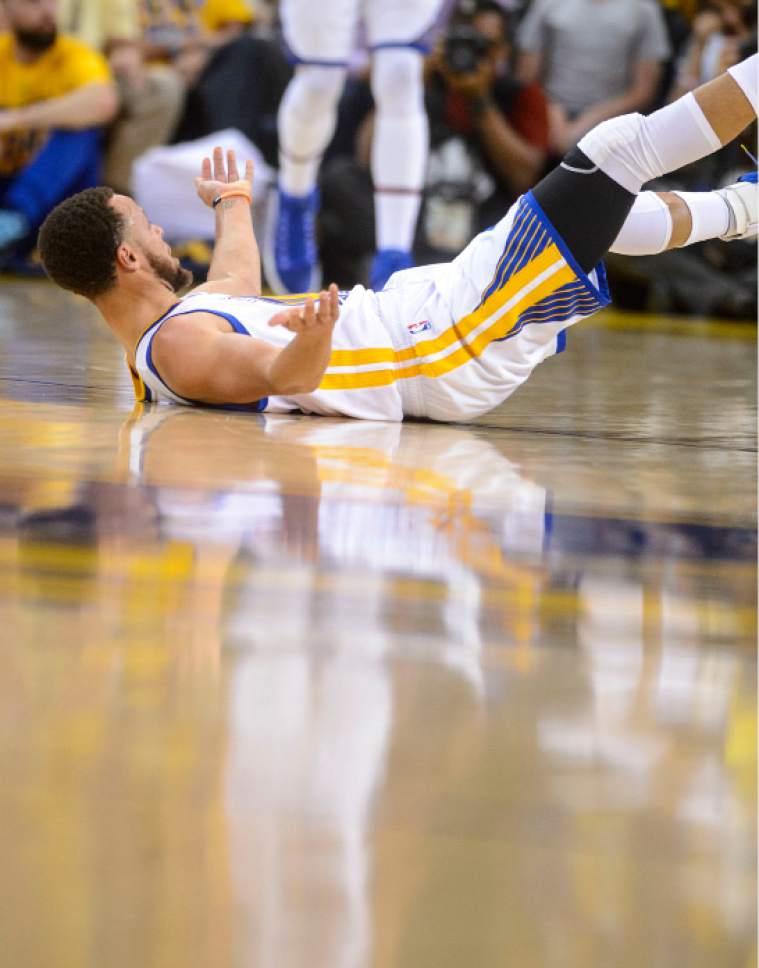 Steve Griffin  |  The Salt Lake Tribune


Golden State Warriors guard Stephen Curry (30) falls to the court after being fouled during NBA playoff game between the Utah Jazz and the Golden State Warriors at Oracle Arena in Oakland Tuesday May 2, 2017.