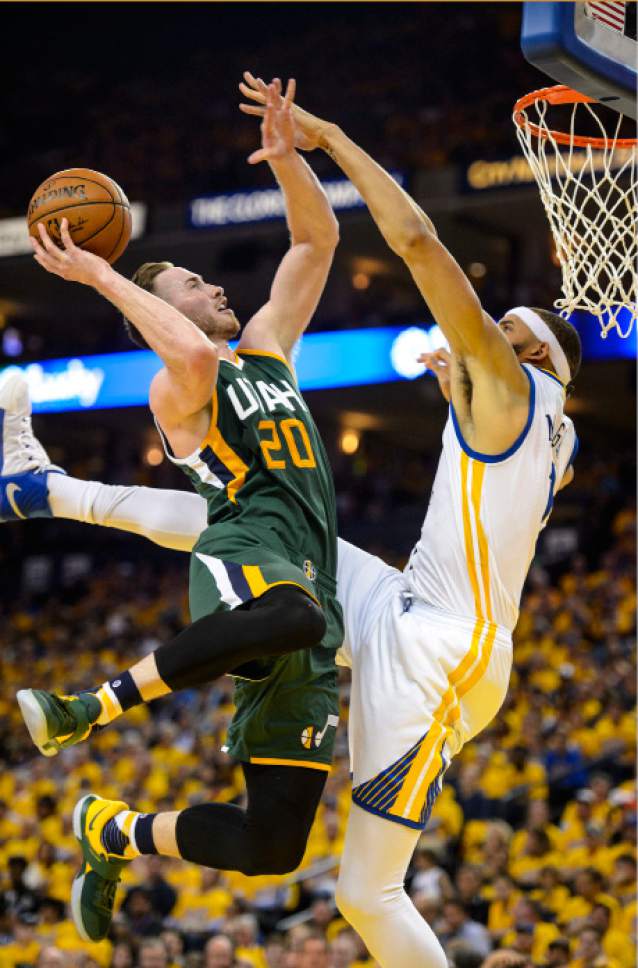 Steve Griffin  |  The Salt Lake Tribune


Utah Jazz forward Gordon Hayward (20) hangs in the air as he shoots over Golden State Warriors center JaVale McGee (1) during NBA playoff game between the Utah Jazz and the Golden State Warriors at Oracle Arena in Oakland Tuesday May 2, 2017.
