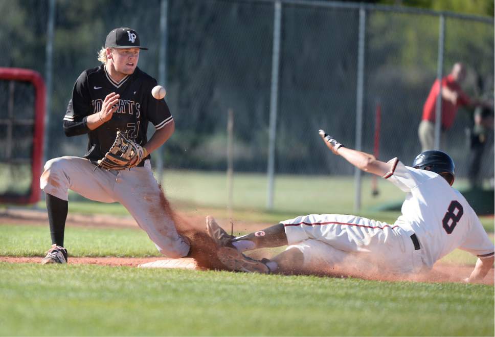 Scott Sommerdorf | The Salt Lake Tribune
Lone Peak 3B Tom Bateman juggles this throw as American Fork's Trell Morse is safe at third. Lone Peak held off a 7th inning rally and beat American Fork 5-3, Friday, May 5, 2017.