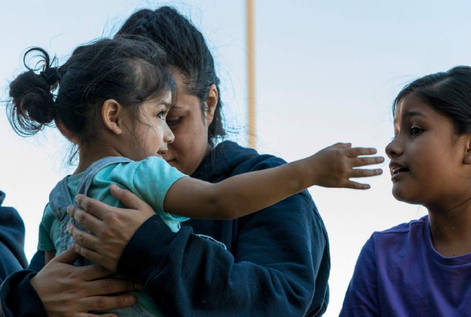 Sydney Oliver  |  Special to The Tribune

Silvia Avelar-Flores is comforted by her daughters Jazira, 8, and Ariana, 2, after anxiously waiting her release from Cache County Jail. Avelar-Flores has been detained since Friday, April 28, 2017 after being arrested by Immigration and Customs Enforcement agents In West Valley, Utah.