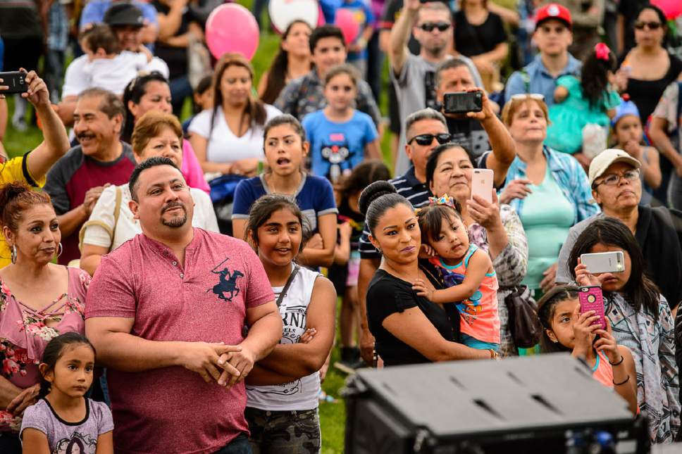 Trent Nelson  |  The Salt Lake Tribune
Fans in the crowd dance as Juan Gabriel performs at the Telemundo Utah Cinco de Mayo Festival in Centennial Park, West Valley City, Saturday May 6, 2017.
