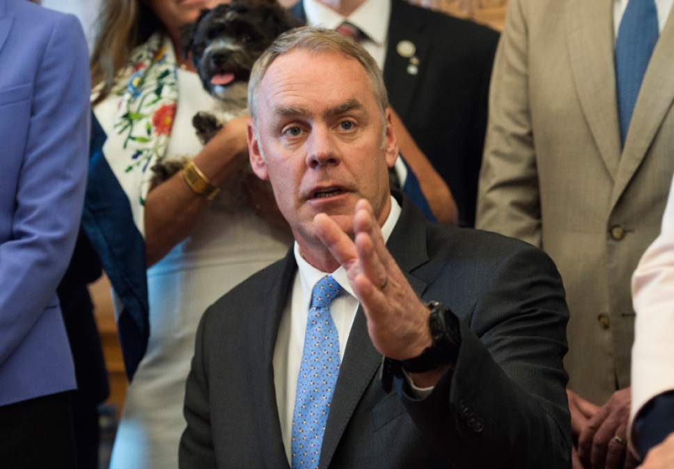 Interior Secretary Ryan Zinke speaks at the Interior Department in Washington, Wednesday, March 29, 2017, after signing an order lifting a moratorium on new coal leases on federal lands and a related order on coal royalties.  (AP Photo/Molly Riley)