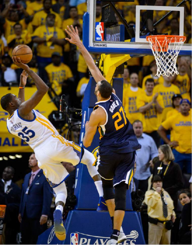 Steve Griffin  |  The Salt Lake Tribune


Golden State Warriors forward Kevin Durant (35) shoots over Utah Jazz center Rudy Gobert (27) during game 2 of the NBA playoff game between the Utah Jazz and the Golden State Warriors at Oracle Arena in Oakland Thursday May 4, 2017.