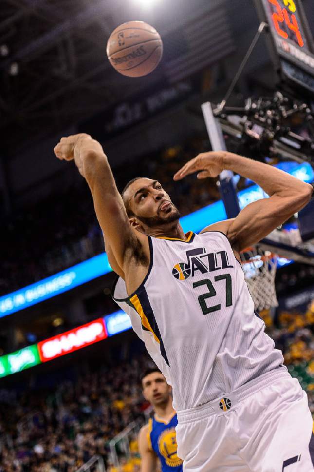 Trent Nelson  |  The Salt Lake Tribune
Jazz center Rudy Gobert saves a ball from going out of bounds as the Utah Jazz host the Golden State Warriors in Game 3 of the second round, NBA playoff basketball in Salt Lake City, Saturday May 6, 2017.