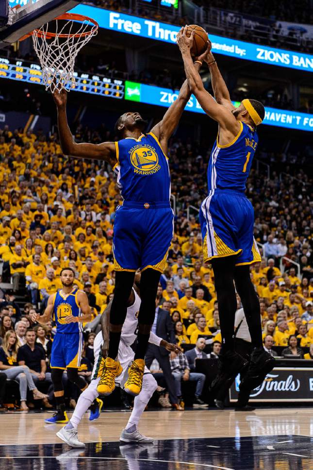 Trent Nelson  |  The Salt Lake Tribune
Golden State Warriors forward Kevin Durant (35) and Golden State Warriors center JaVale McGee (1) pull down a rebound as the Utah Jazz host the Golden State Warriors in Game 3 of the second round, NBA playoff basketball in Salt Lake City, Saturday May 6, 2017.