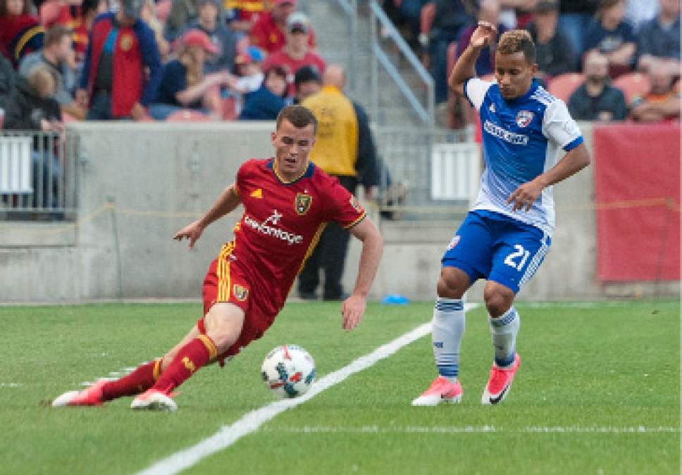 Michael Mangum  |  Special to the Tribune

Real Salt Lake midfielder Brooks Lennon (27) slips as he tries to keep the ball inbounds with pressure from FC Dallas midfielder Michael Barrios (21) during their match at Rio Tinto Stadium in Sandy, UT on Saturday, May 6, 2017.
