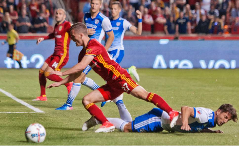 Michael Mangum  |  Special to the Tribune

Real Salt Lake midfielder Brooks Lennon (27) falls to the pitch after contact with FC Dallas defender Hernan Grana (2) in the box during their match at Rio Tinto Stadium in Sandy, UT on Saturday, May 6, 2017.