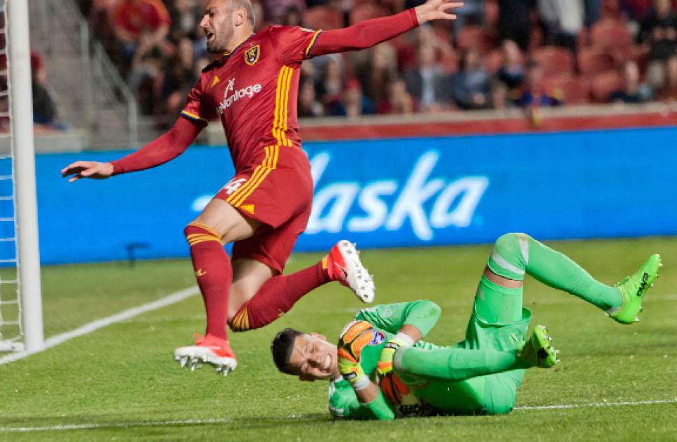 Michael Mangum  |  Special to the Tribune

FC Dallas goalkeeper Jesse Gonzalez (1) snatches the ball from an onrushing Real Salt Lake forward Yura Movsisyan (14) during their match at Rio Tinto Stadium in Sandy, UT on Saturday, May 6, 2017.