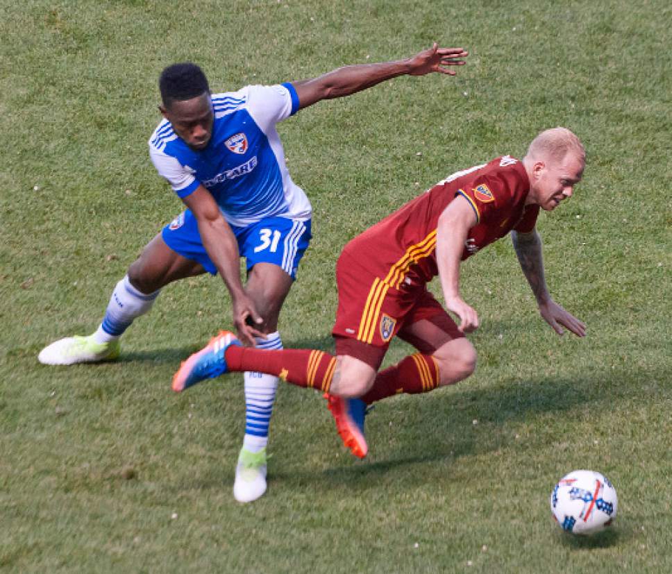 Michael Mangum  |  Special to the Tribune

Real Salt Lake midfielder Luke Mulholland (19) gets tripped up by FC Dallas defender Maynor Figueroa (31) during their match at Rio Tinto Stadium in Sandy, UT on Saturday, May 6, 2017.