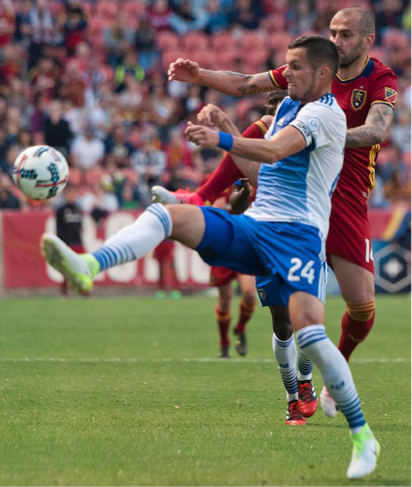 Michael Mangum  |  Special to the Tribune

Real Salt Lake forward Yura Movsisyan (14) battles for possession with FC Dallas defender Matt Hedges (24) during their match at Rio Tinto Stadium in Sandy, UT on Saturday, May 6, 2017.