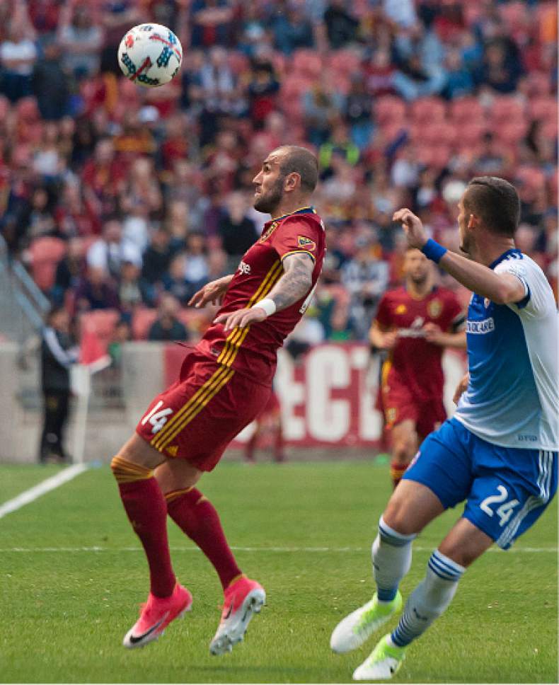 Michael Mangum  |  Special to the Tribune

Real Salt Lake forward Yura Movsisyan (14) eyes the ball as he tries to gain possession in front of FC Dallas defender Matt Hedges (24) during their match at Rio Tinto Stadium in Sandy, UT on Saturday, May 6, 2017.
