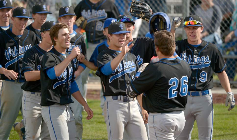 Leah Hogsten  |  The Salt Lake Tribune 
Pleasant Grove celebrates Staley Hansgen's home run to lift the Vikings up three runs, 5-2,  over the Knights in the 6th.  Lone Peak High School boys' baseball team defeated Pleasant Grove High School 8-5 during their game Monday, May 8, 2017.