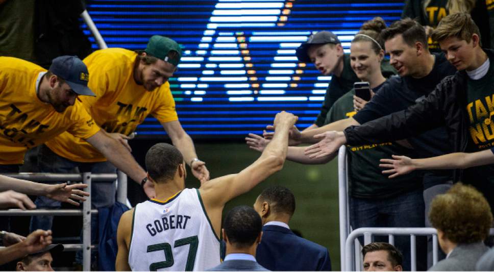 Steve Griffin  |  The Salt Lake Tribune


Utah Jazz center Rudy Gobert (27) slaps hands with the fans as he leaves the court after the Jazz fell to the Warriors in game 4 of the NBA playoffs at Vivint Smart Home Arena in Salt Lake City Monday May 8, 2017.