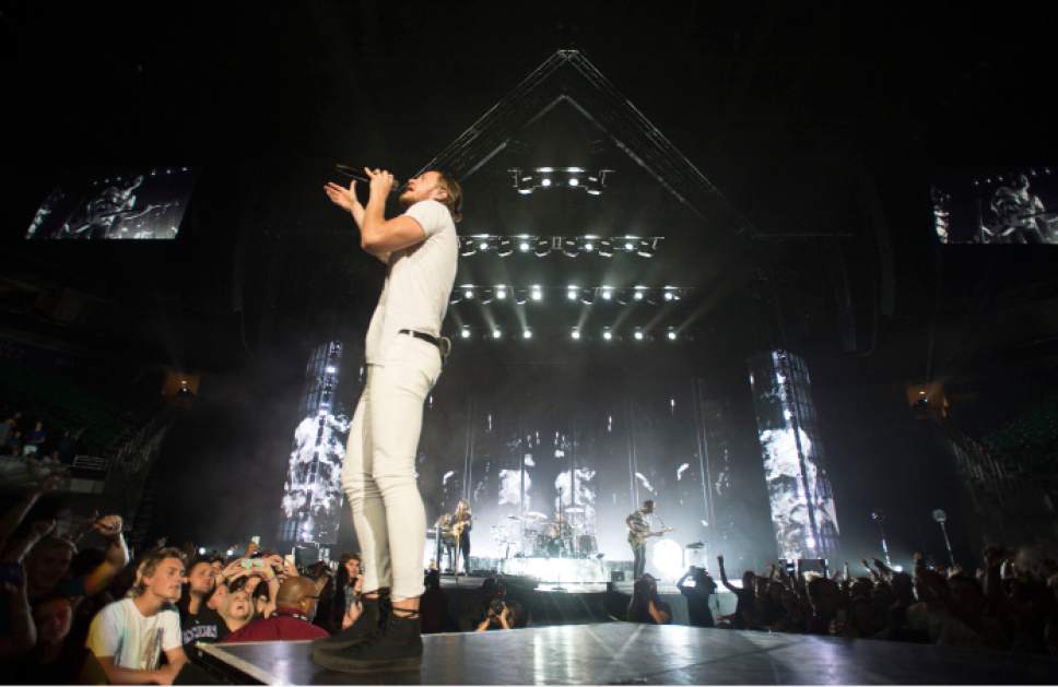Steve Griffin  |  The Salt Lake Tribune


Dan Reynolds sings to the crowd during the Imagine Dragons "Smoke and Mirrors" tour at EnergySolutions Arena in Salt Lake City, Tuesday, July 28, 2015.