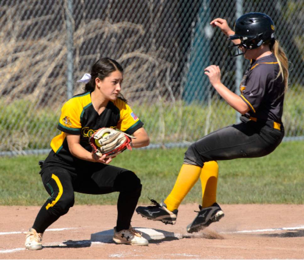 Steve Griffin  |  The Salt Lake Tribune


Cyprus runner Riley Newbold gets to third ahead of the tag by Kearns third baseman Vanessa Sasaki during the Cyprus versus Kearns softball game  in Kearns Tuesday May 9, 2017.