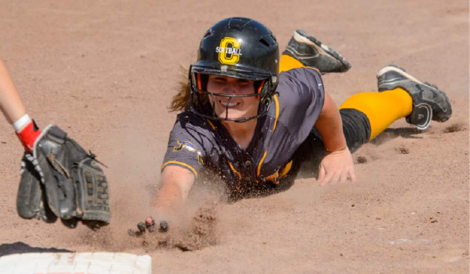 Steve Griffin  |  The Salt Lake Tribune


Cyprus baserunner Kylie Williams dives back to first during the Cyprus versus Kearns softball game  in Kearns Tuesday May 9, 2017.