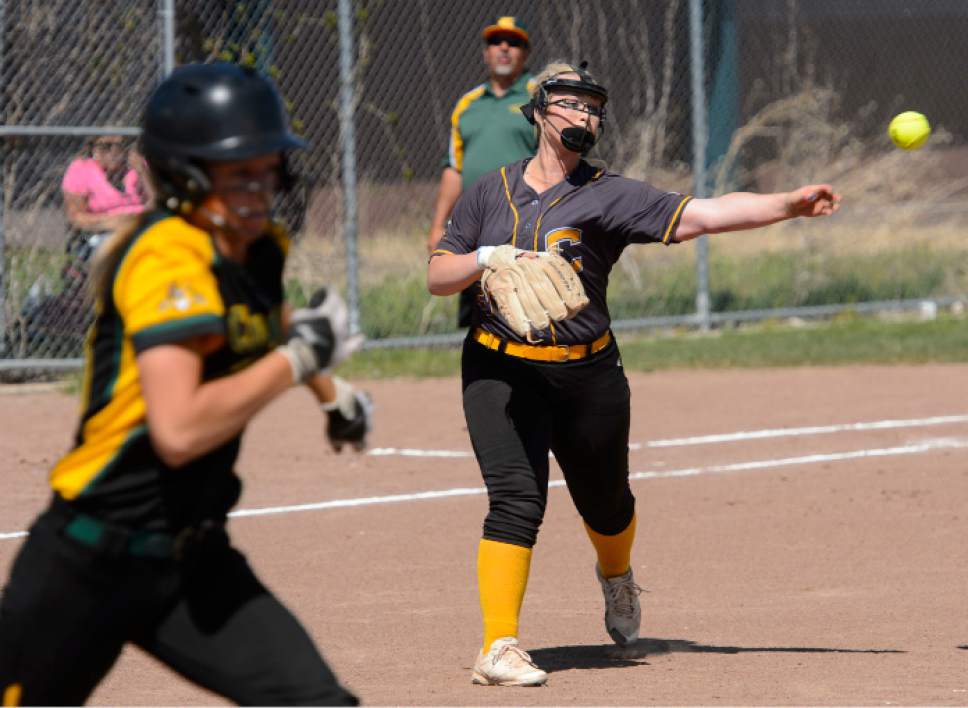 Steve Griffin  |  The Salt Lake Tribune


Cyprus pitcher Alexis Poulsen fires to first for an out during the Cyprus versus Kearns softball game  in Kearns Tuesday May 9, 2017.