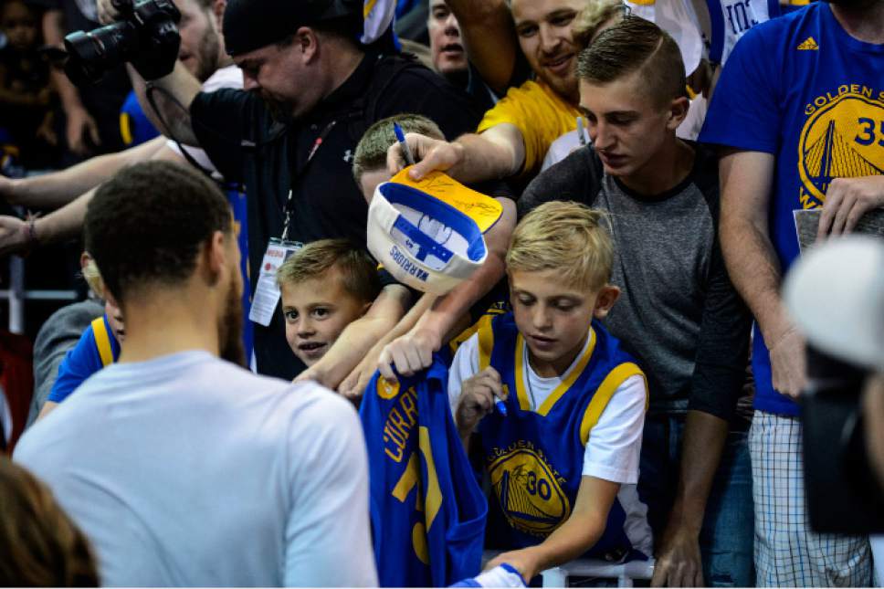 Steve Griffin  |  The Salt Lake Tribune


Golden State Warriors guard Stephen Curry (30) signs autographs prior to game 4 of the NBA playoff game between the Utah Jazz and the Golden State Warriors at Vivint Smart Home Arena in Salt Lake City Monday May 8, 2017.