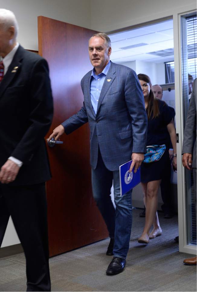 Scott Sommerdorf | The Salt Lake Tribune
Secretary of the Interior Ryan Zinke enters to speak at a brief press conference after having met with members of the Bears Ears Commission Sunday at the Bureau of Land Management office at the Gateway in Salt Lake City, Sunday, May 7, 2017.