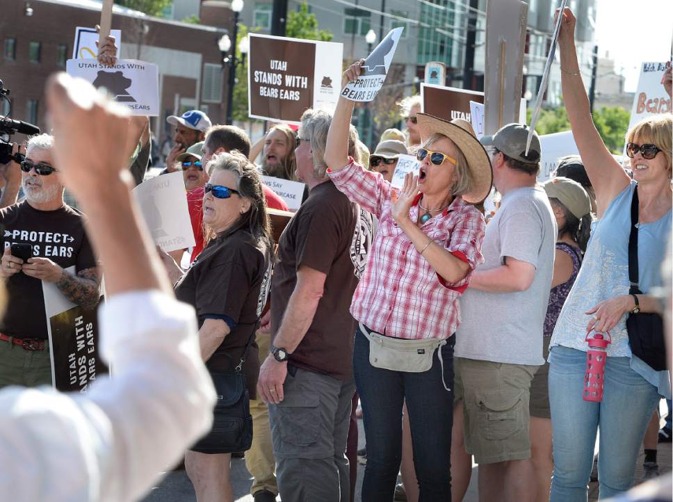 Scott Sommerdorf | The Salt Lake Tribune
Protestors chanted in favor of the Bears Ears Monument as cars left the Gateway Shopping Mall near the BLM offices. They were hoping to get a glimpse of Secretary of the Interior Ryan Zinke who spoke at a brief press conference after having met with members of the Bears Ears Commission Sunday at the Bureau of Land Management office at the Gateway in Salt Lake City, Sunday, May 7, 2017.