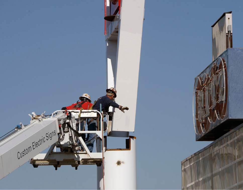 Al Hartmann  |  The Salt Lake Tribune
Workers for Yesco Sign ease the 90-foot-tall iconic bowling pin sign onto its base on State Street in South Salt Lake Tuesday May, 9. It was originally built in 1958 and was disassembled on April 12, 2017 for a complete renovation. 
It now will mark the entrance to the new Ritz Classic Apartments, under construction at 2265 S. State.