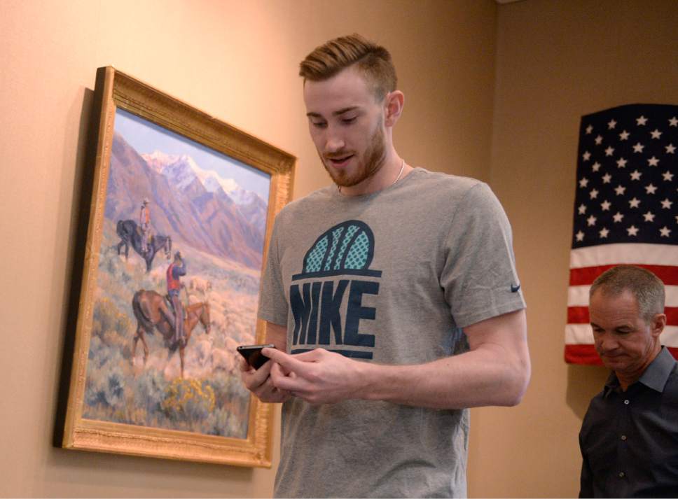 Al Hartmann  |  The Salt Lake Tribune
Jazz player Gordan Hayward checks his phone before exit interview with the sports media in Salt Lake City Tuesday May 9.  The team cleaned out their lockers after their loss to the Golden State Warriors last night.