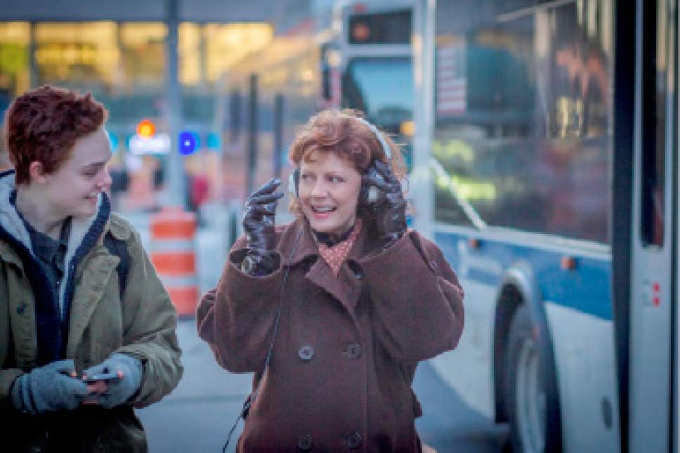 Ray (Elle Fanning, left), a trans teen boy, shares some music with his grandmother, Dolly (Susan Sarandon), in the drama "3 Generations." Courtesy The Weinstein Company