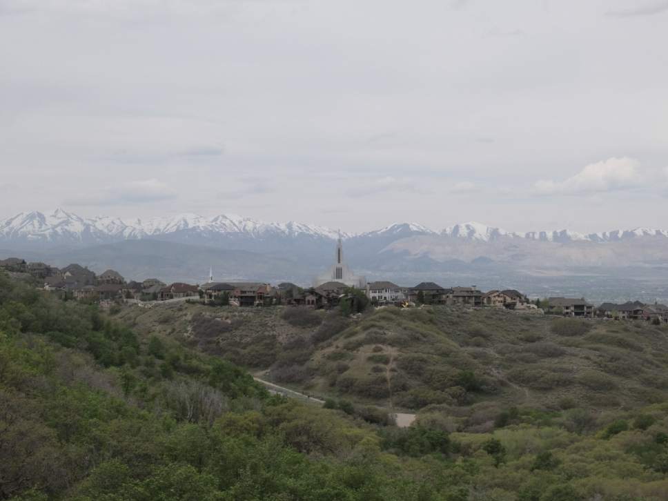 Nate Carlisle  |  The Salt Lake Tribune


The Draper LDS Temple sits with Salt Lake County and the Oquirrh Mountains in the background when seen from the Canyon Hollow Trail on May 6, 2017.