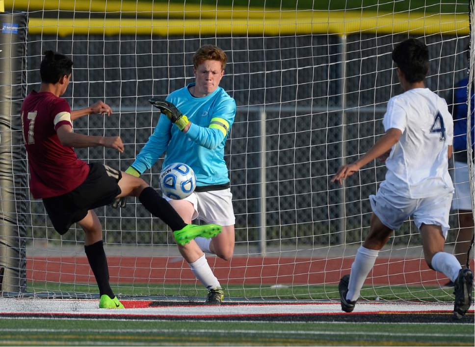 Scott Sommerdorf | The Salt Lake Tribune
Somehow Logan's Miguel Martinez did not score on this second half shot against Juan Diego goalkeeper Martin Kelly. Juan Diego defeated Logan 3-1 in a 3A boy's semi-final, Friday, May 12, 2017.