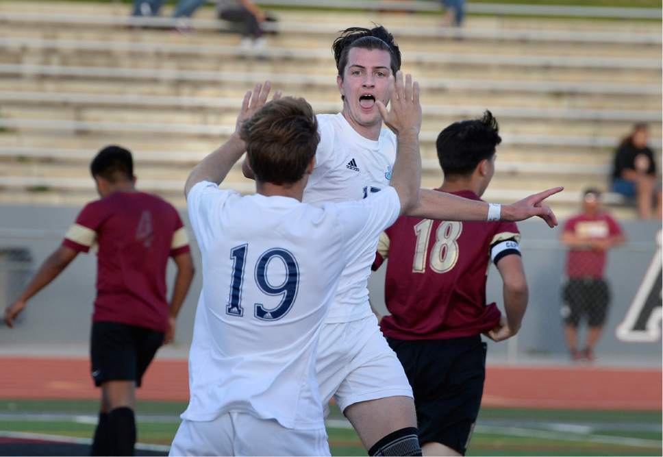 Scott Sommerdorf | The Salt Lake Tribune
Derek Stuercke, right, celebrates his goal with team mate Jared Mariani to give Juan Diego a 3-0 lead. Juan Diego defeated Logan 3-1 in a 3A boy's semi-final, Friday, May 12, 2017.