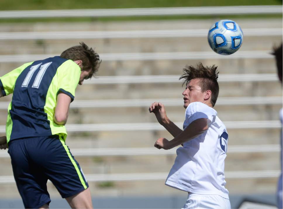 Scott Sommerdorf | The Salt Lake Tribune
Snow Canyon's Benton Kemp, right, battles for a header vs Ridgeline's Reggie Anderson during first half play. Ridgeline beat Snow Canyon 2-1 in a 3A boy's semi-final, Friday, May 12, 2017.